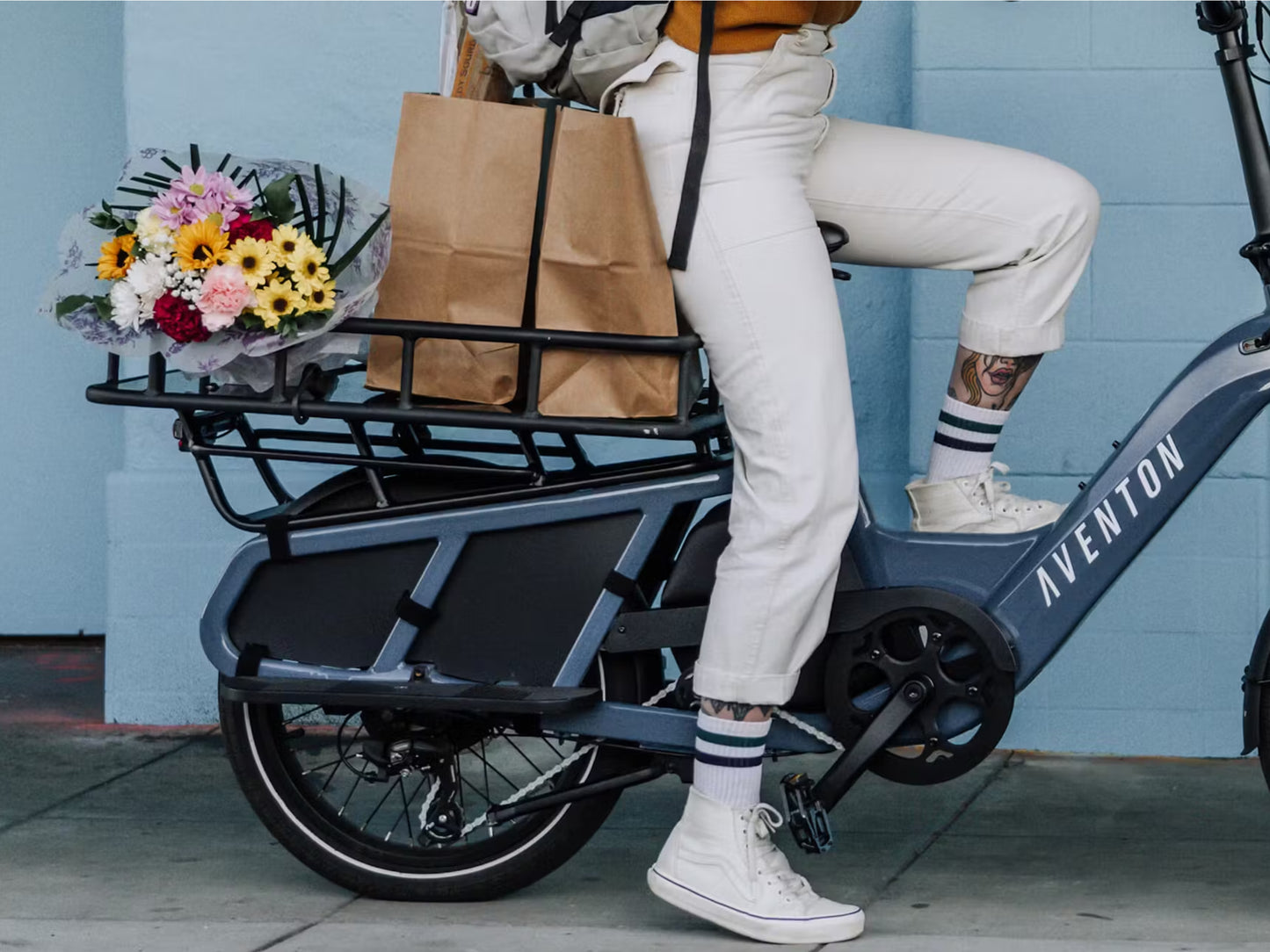 Aventon Abound Rear Rack Basket Shown on bike with grocery & flower haul