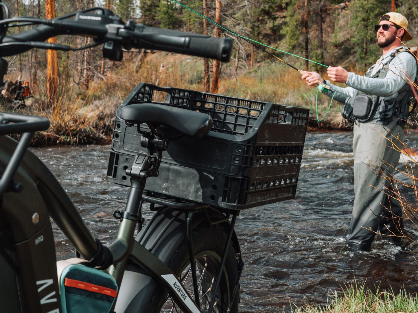 Aventon Aventure 3 Hardtail All Terrain Electric Bike Fly Fisherman in a river. Optional accessories shown