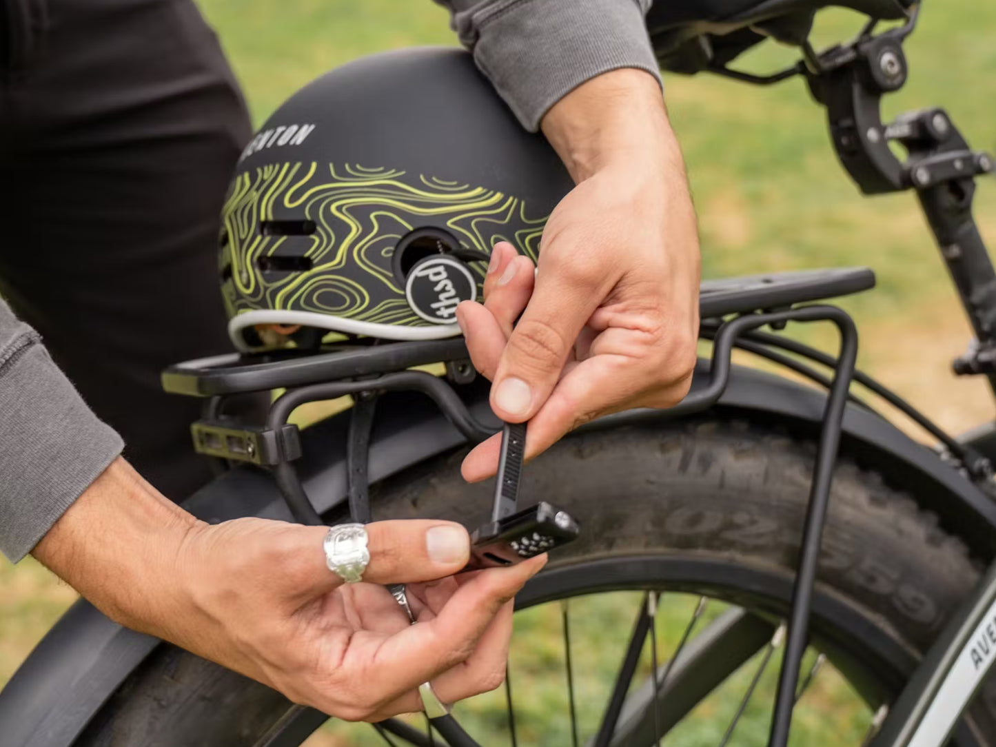 Aventon Zip Lock Shown securing a helmet to a rear rack