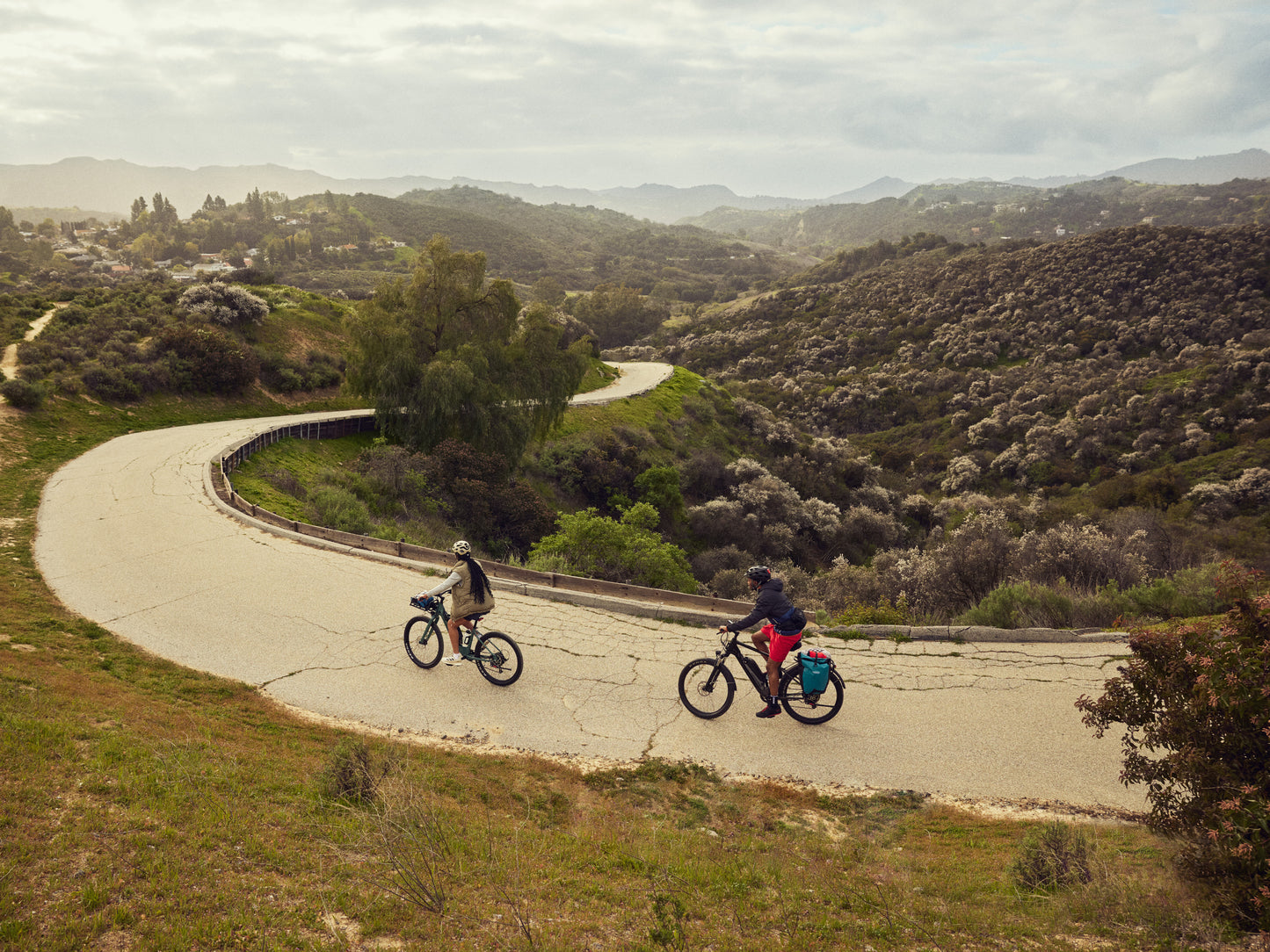 Cannondale Adventure Neo Allroad EQ  Road/commuter lifestyle. Couple riding on a paved path in the hills.