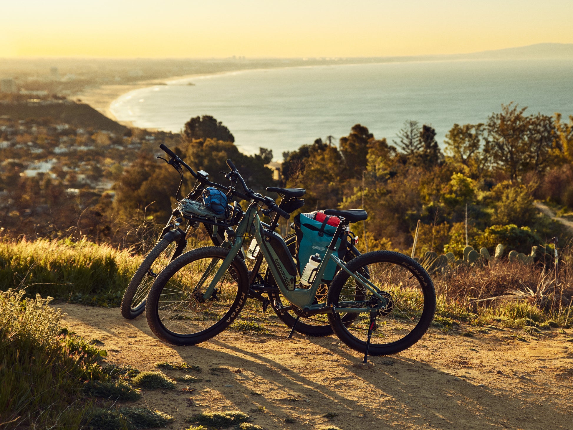 Cannondale Adventure Neo Allroad EQ  Road/commuter Graphite lifestyle. Parked on a dirth path, overlooking the ocean.