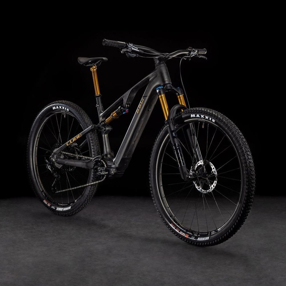 Cube AMS Hybrid One44 SLT Angled view on black background. Carbon 'n' golddust