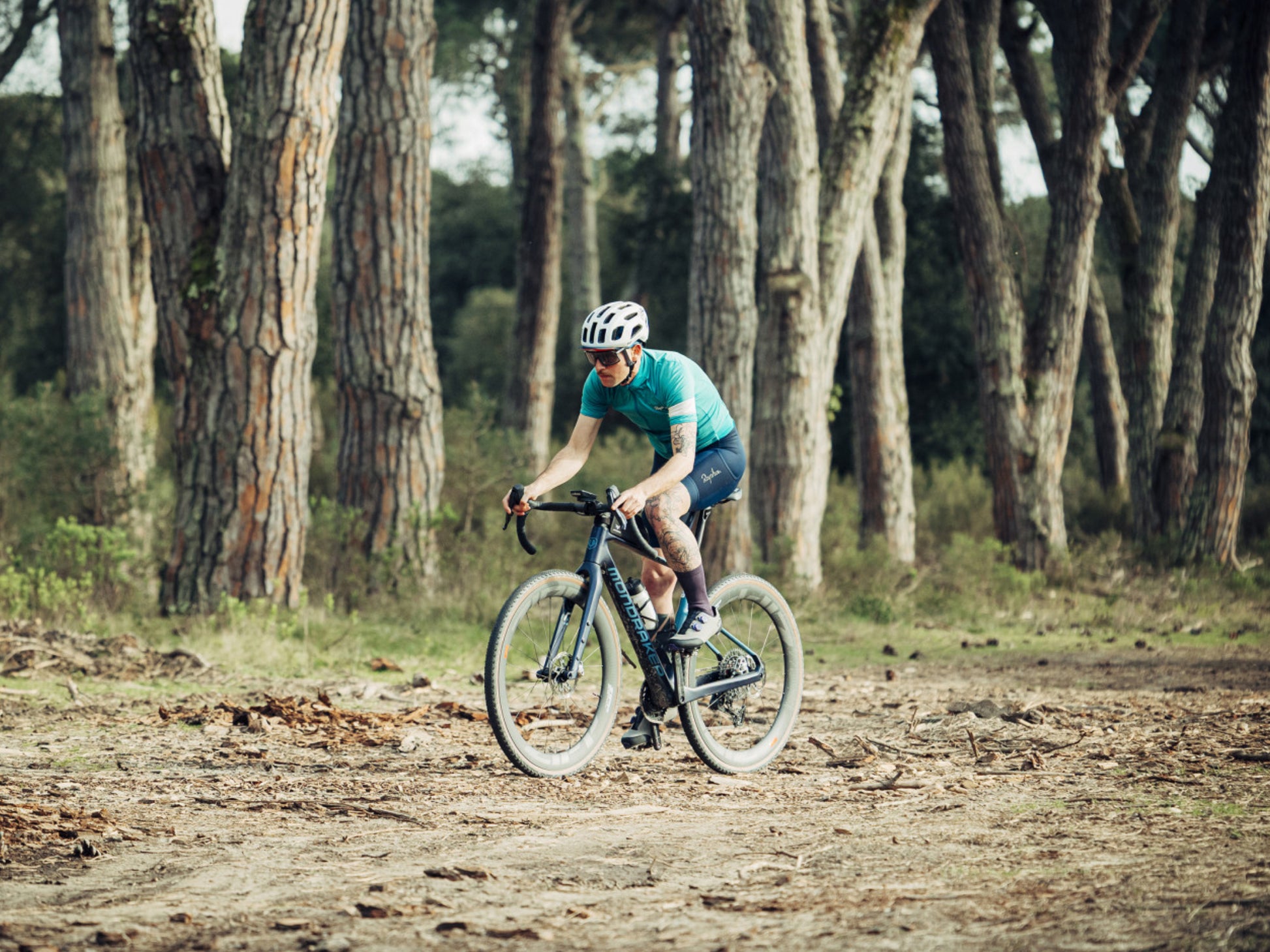 Mondraker Arid Carbon RR SL Gravel Road / commuter bike Rider on gravel tree lined path