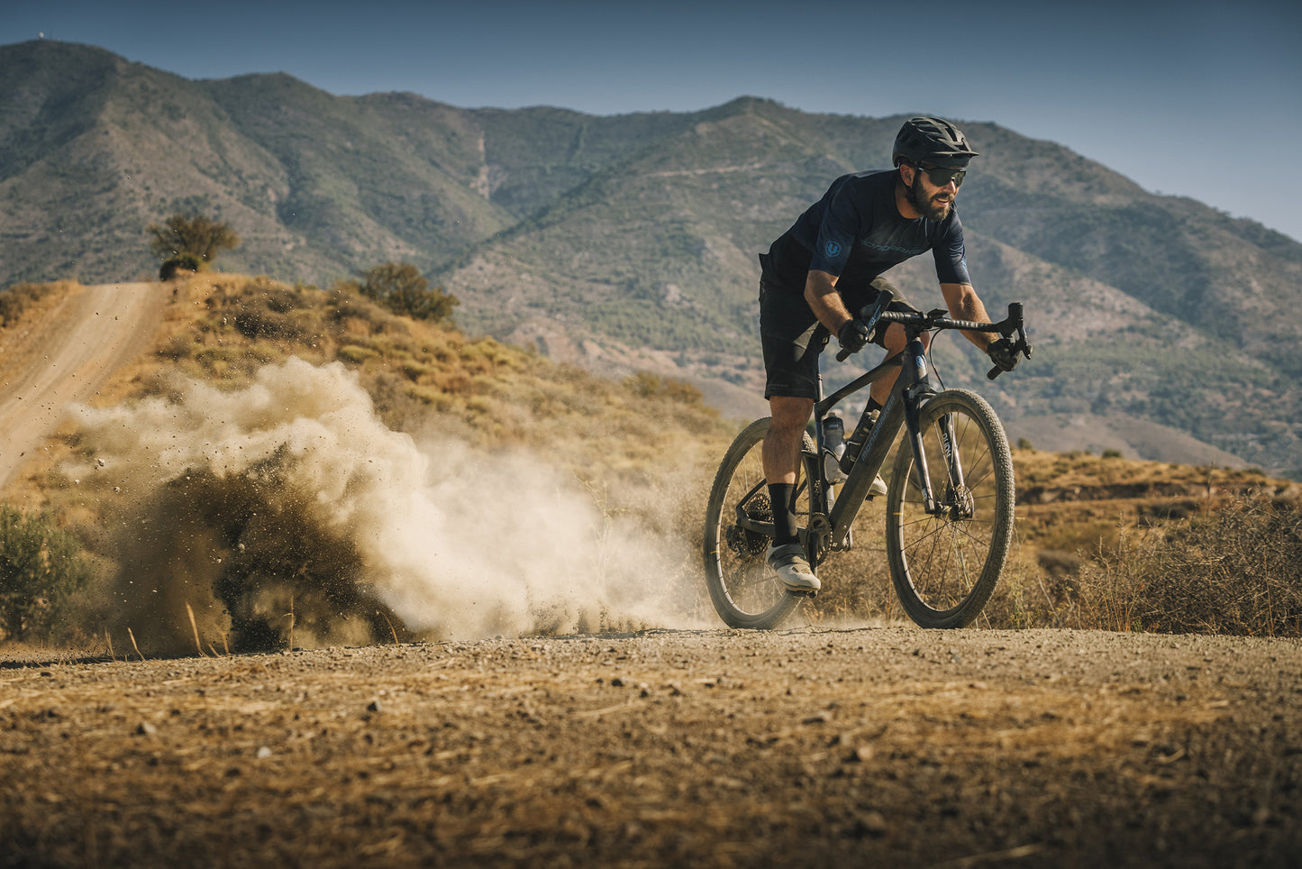 Mondraker Dusty Gravel bike Man Riding Gravel trail
