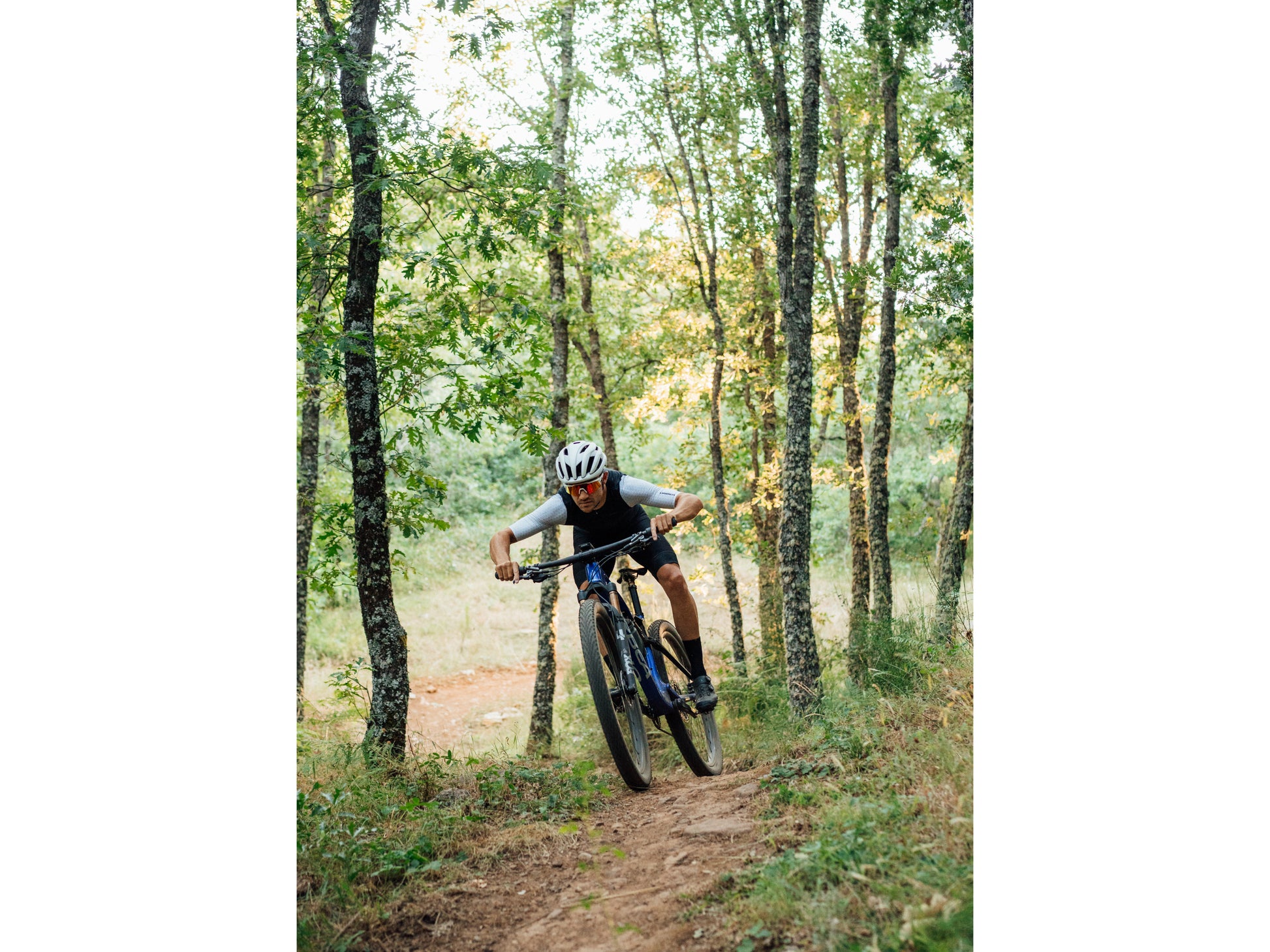 Orbea Oiz Full Suspension Mountain bike Rider on forest dirt trail