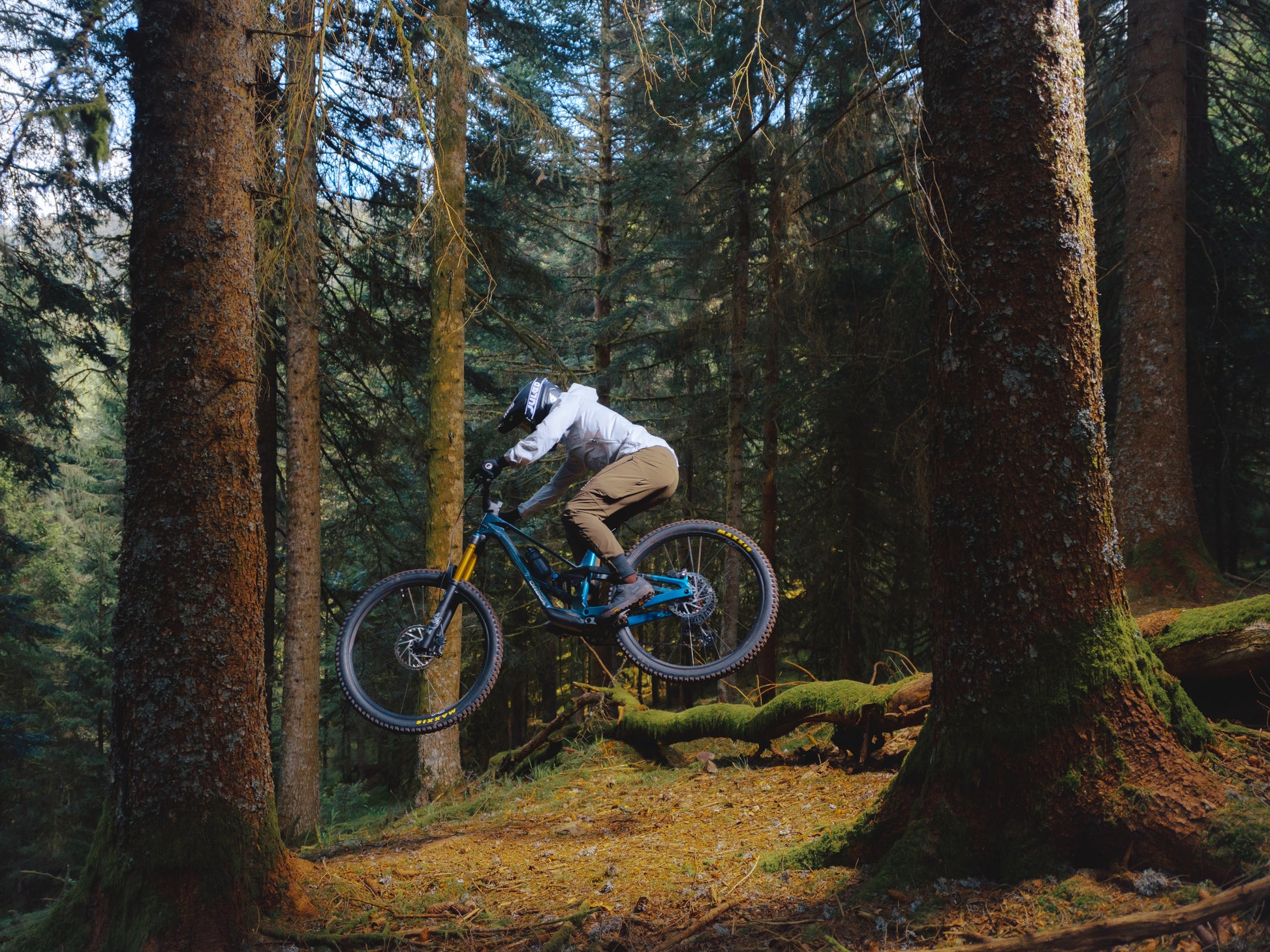 Orbea Rallon E-LTD Full Suspension mountain bike Enduro Rider jumping and catching air in a mountain setting