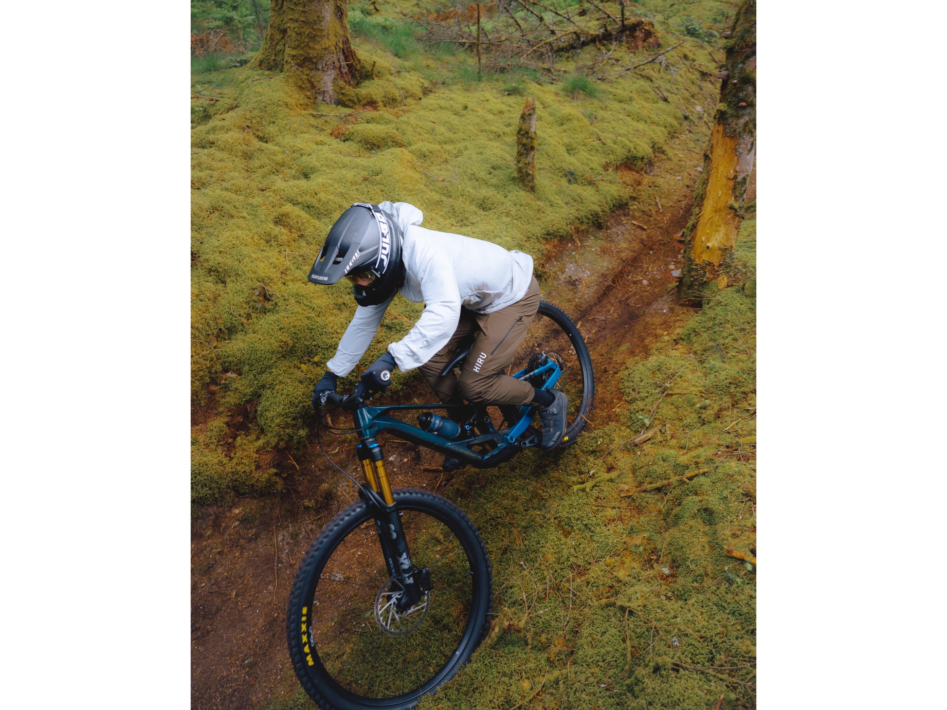 Orbea Rallon Full Suspension mountain bike Enduro Rider on a single dirt track in a mountain setting