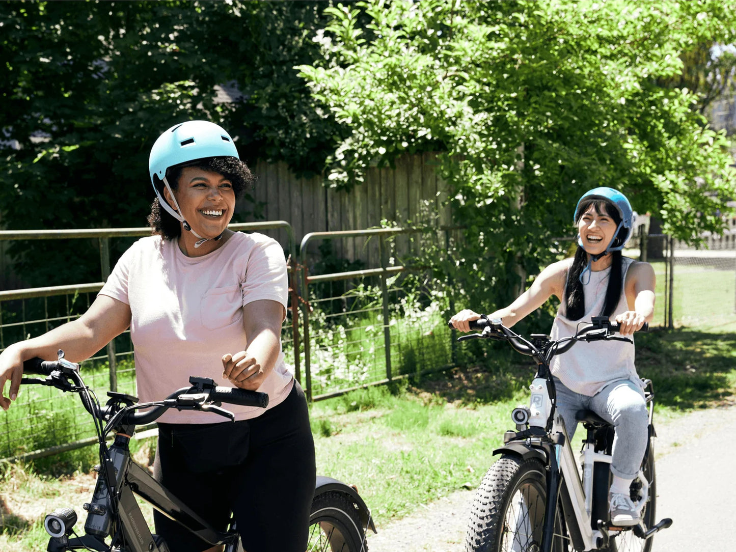 Rad Power RadRover™ 6 Plus Electric Fat Tire Bike Step-Thru Steelhead Green. Women enjoying a sunny ride