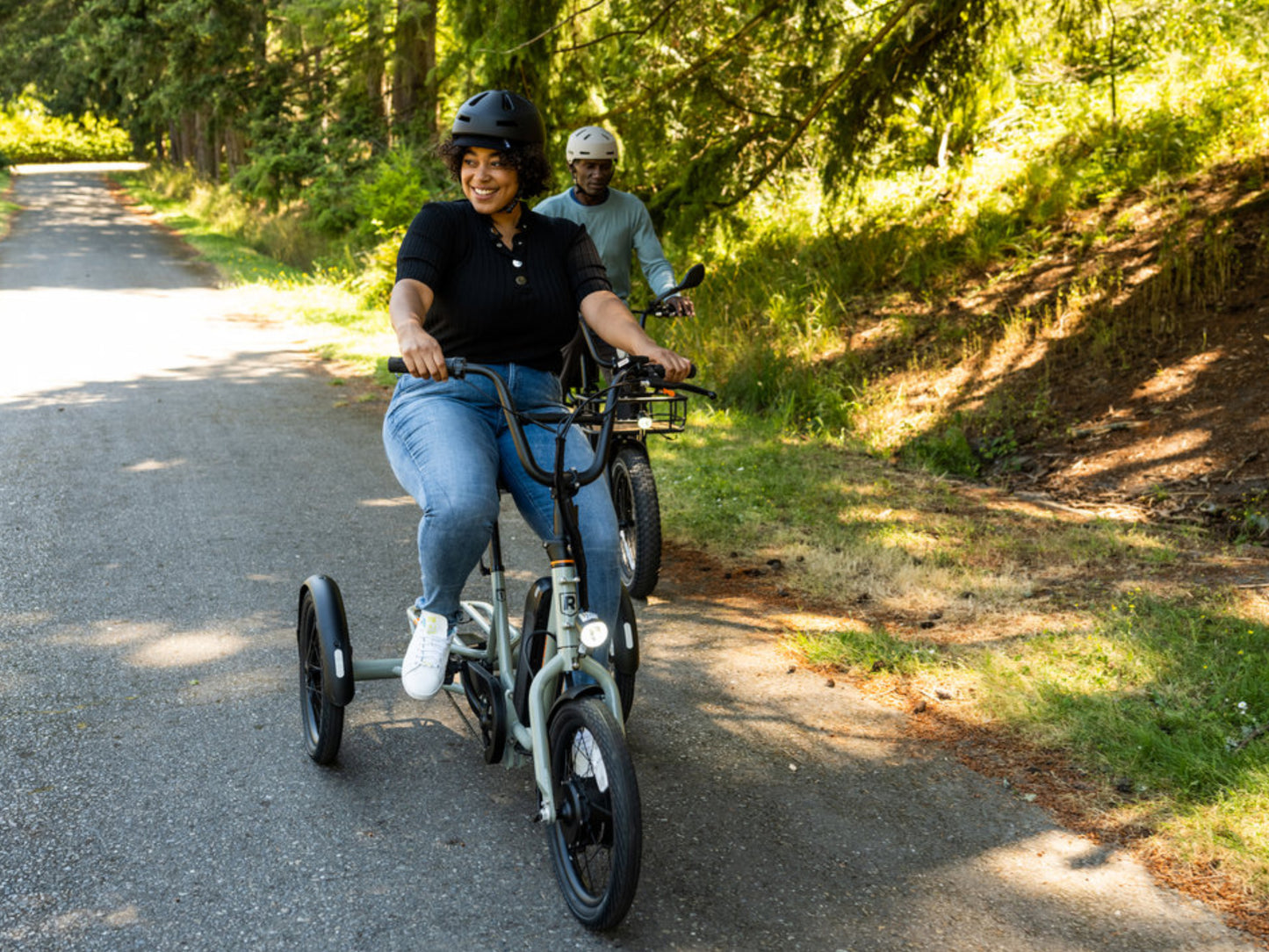 Rad Power RadTrike™ Electric Tricycle Gray Man and woman enjoying a ride on a paved path