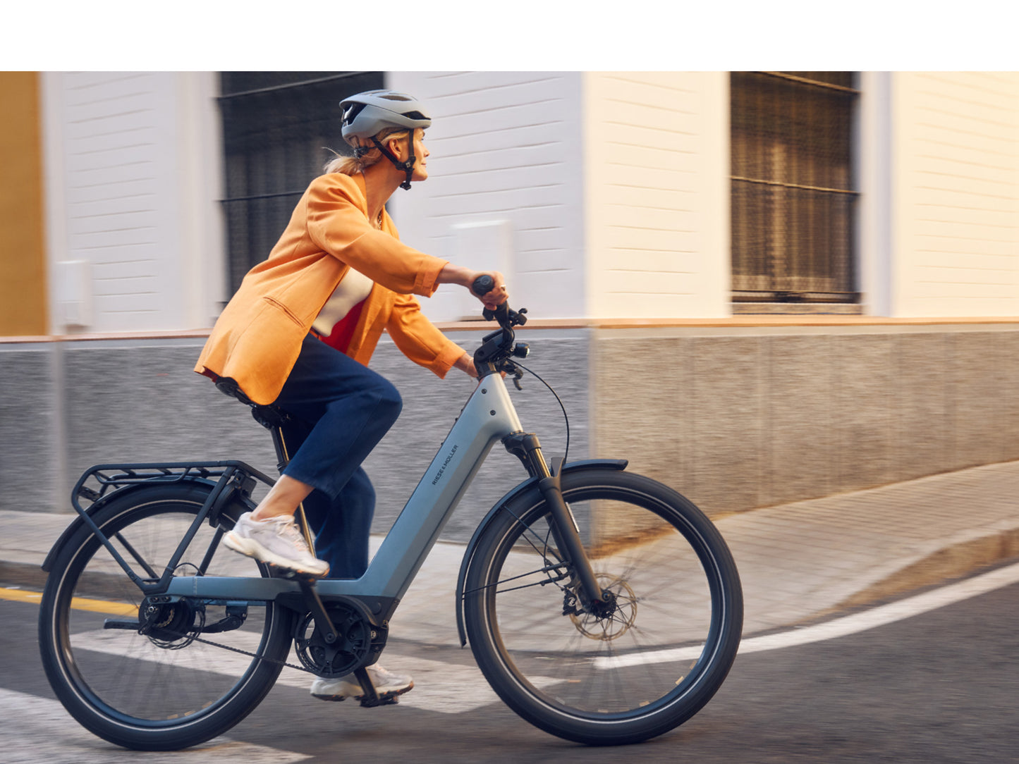 Riese and Muller Nevo5 Female rider commuting on city streets
