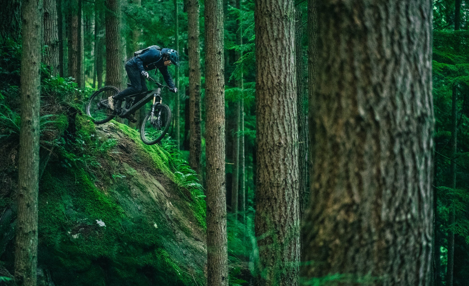 Transition Repeater EP8 Lifestyle Man riding, jumping mountain terrain