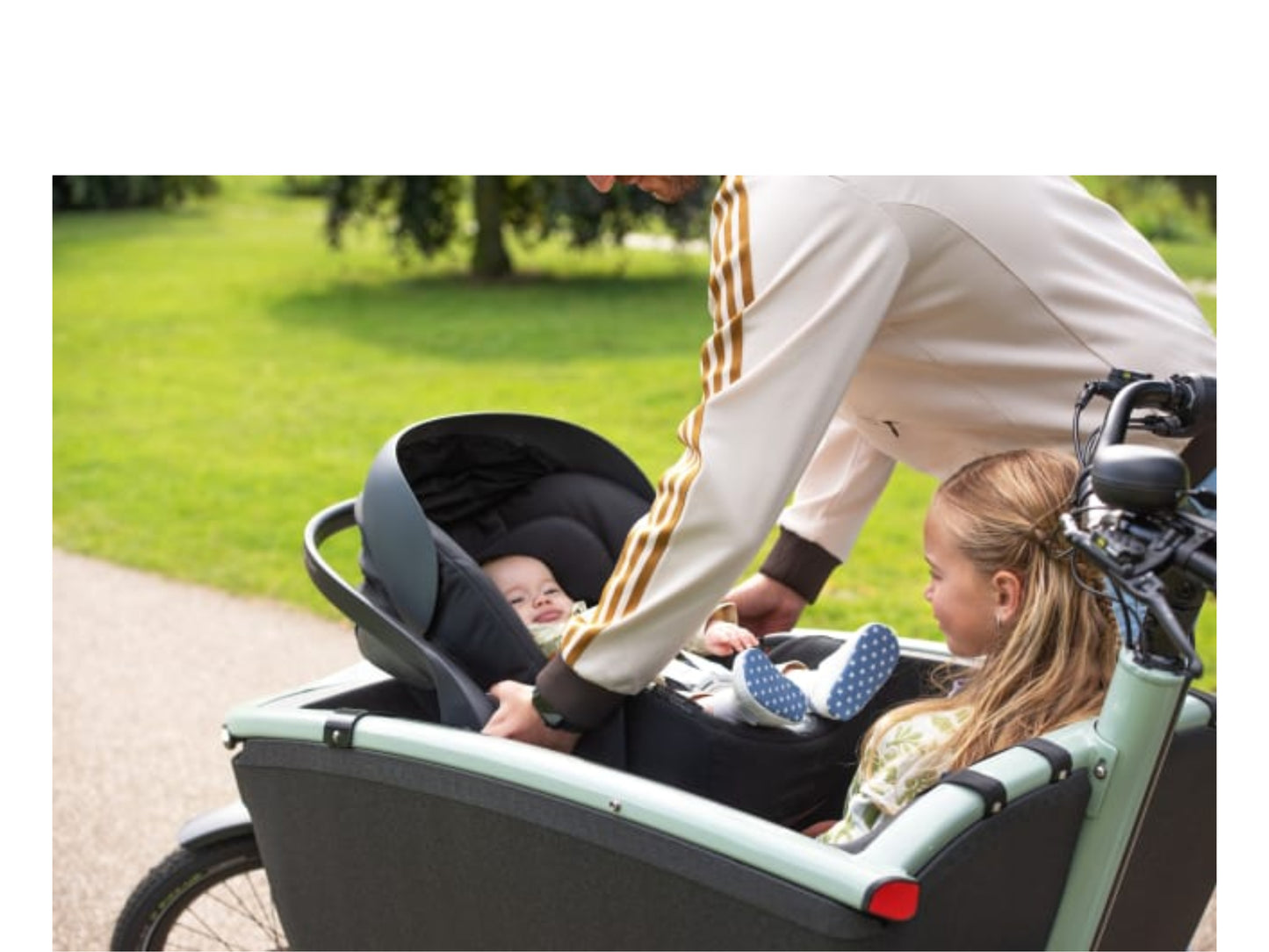 Urban Arrow FamilyNext Baby Car Seat Adapter Shown with baby in careat installed and a child