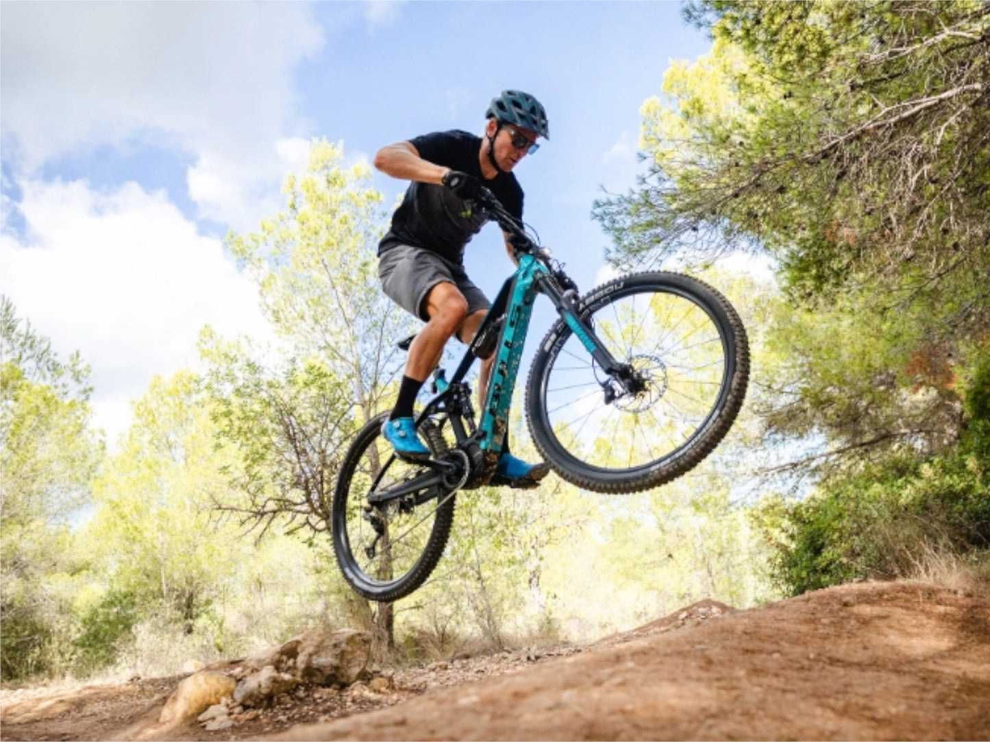 Bulls Copperhead EVO AM 1 750 eMTB full suspension dark petrol riding forest single track trail.jpg