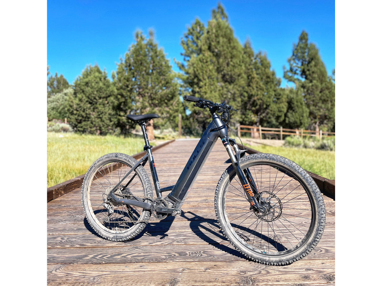 Bulls Copperhead EVO HD 750 Wave eMTB hard tail Chrome black matte black orange outdoor front side profile on Fly Rides