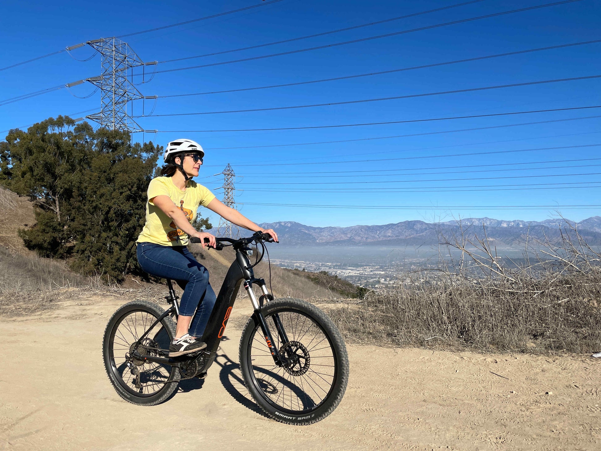 Bulls Copperhead Evo eMTB Hardtail riding in hills above city on Fly Rides