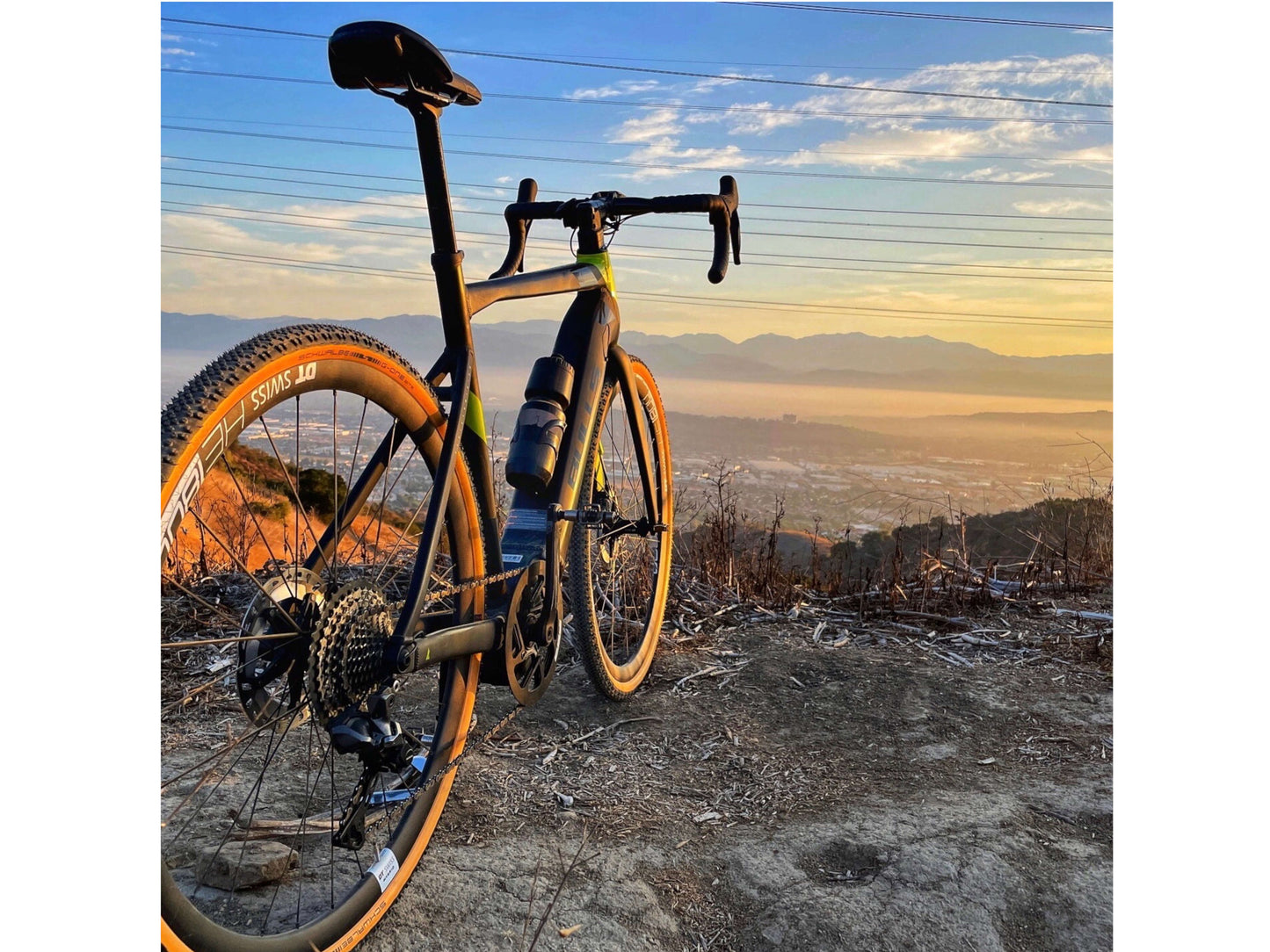 Bulls Desert Falcon EVO e road bike Chrome red black road side profile with valley in background