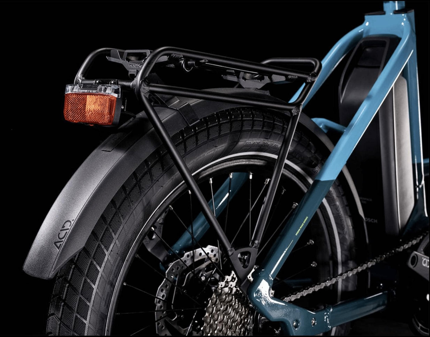 Cube Compact Sport Hybrid 500 eBike Blue and Lime rear tire and storage on Fly Rides