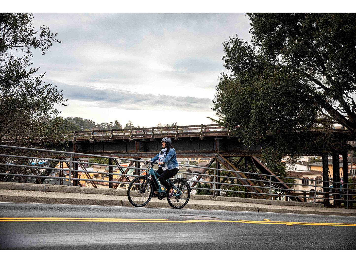 Gazelle Medeo T10 Mid Step action photo of riding uphill on city street