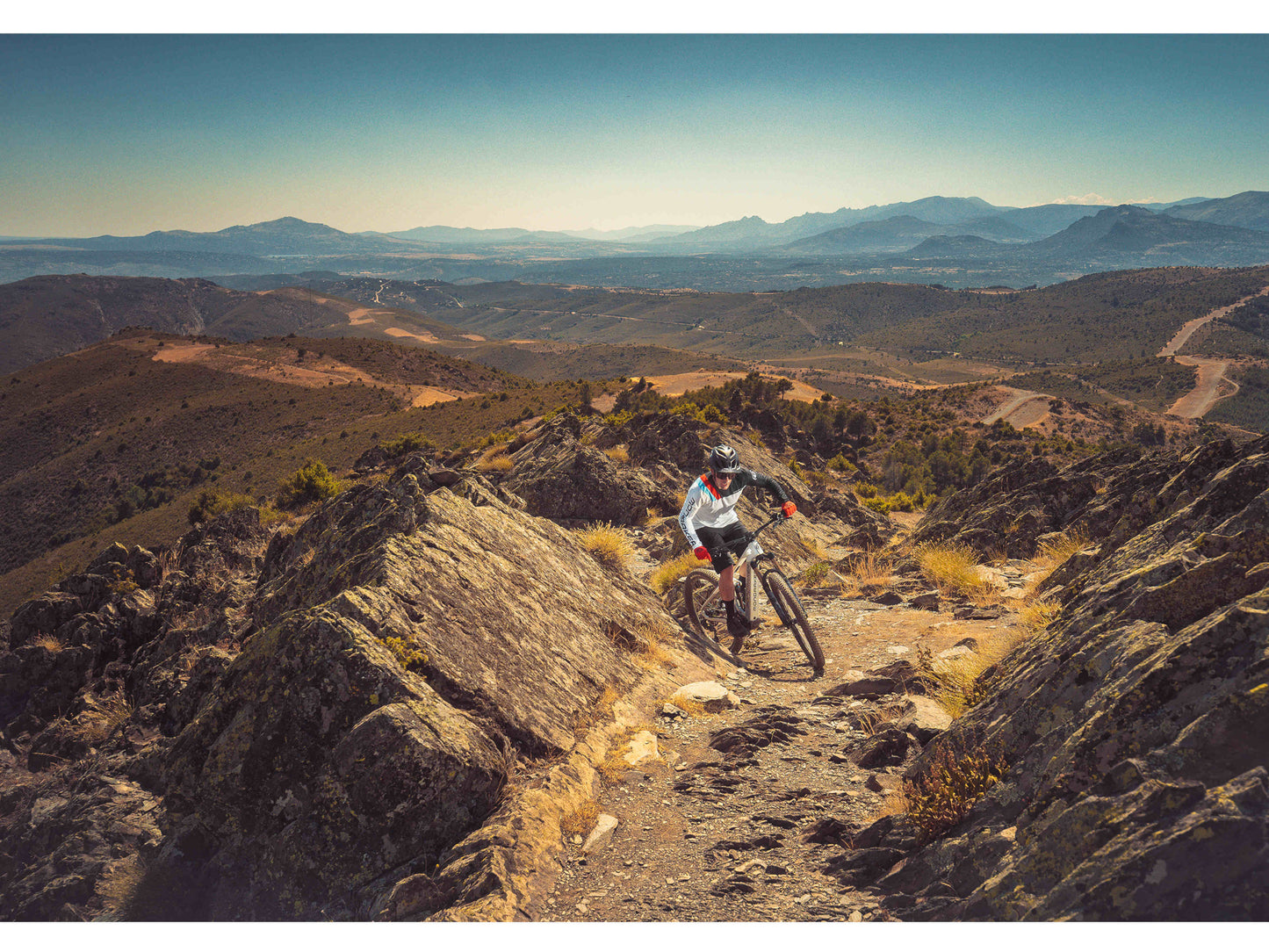 Mondraker Crafty XR eMTB full suspension riding up single track trail