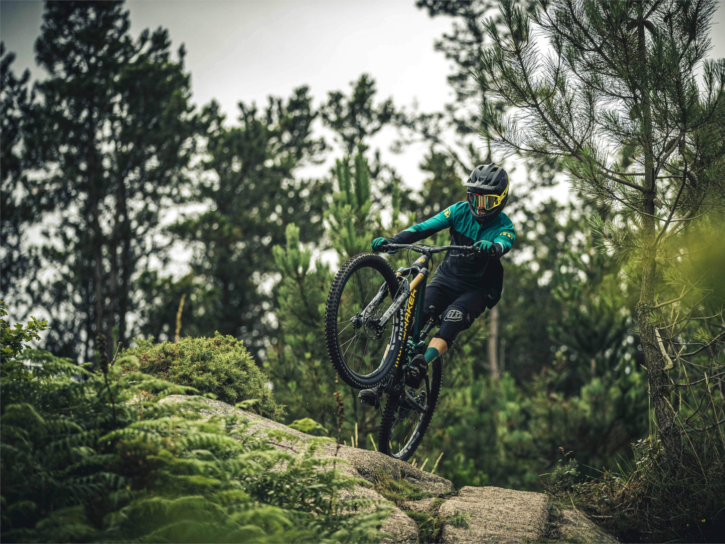 Mondraker Level R electric mountain bike rider jumping on trail on Fly Rides