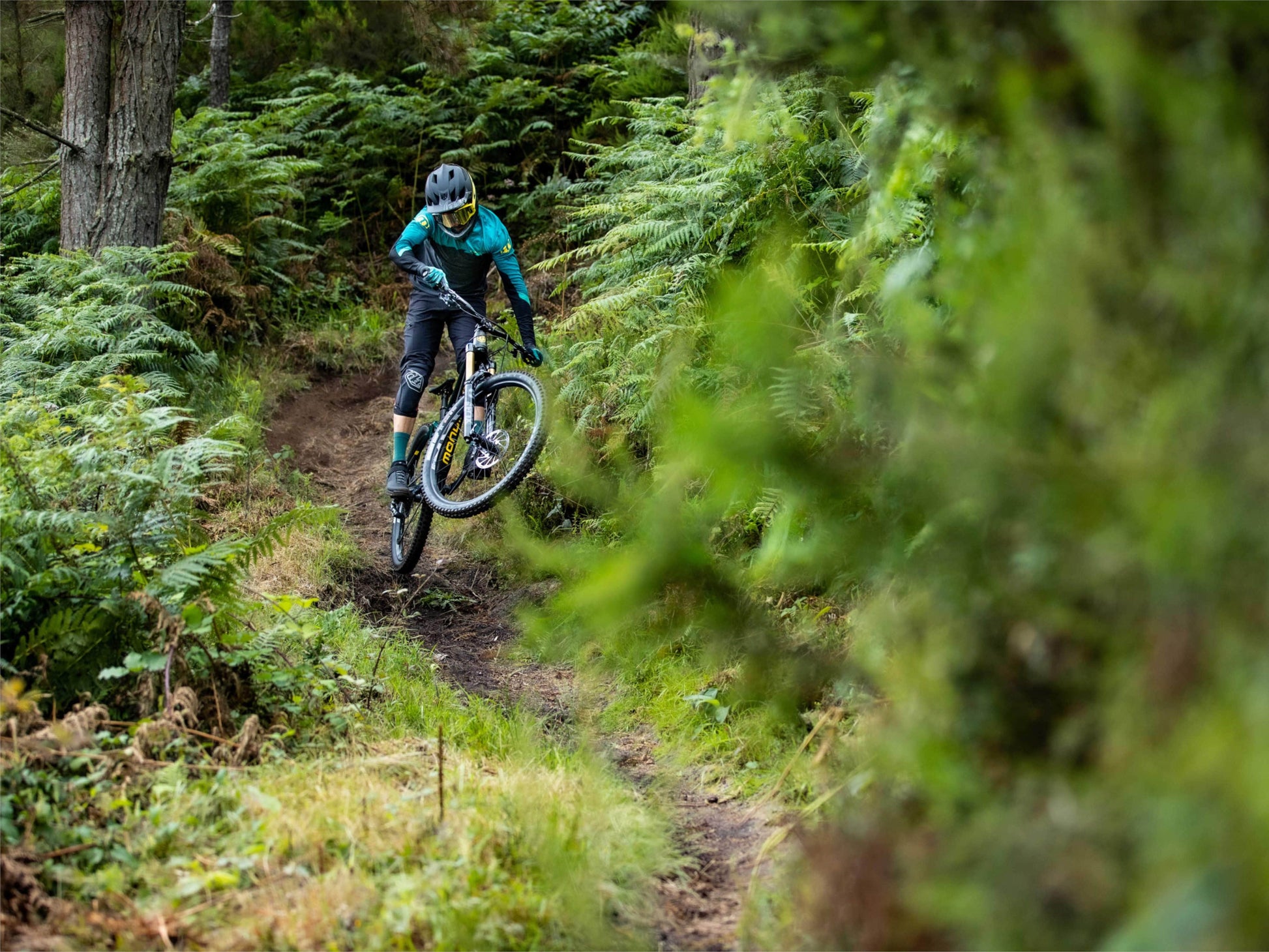 Mondraker Level R electric mountain bike riding on trail on Fly Rides