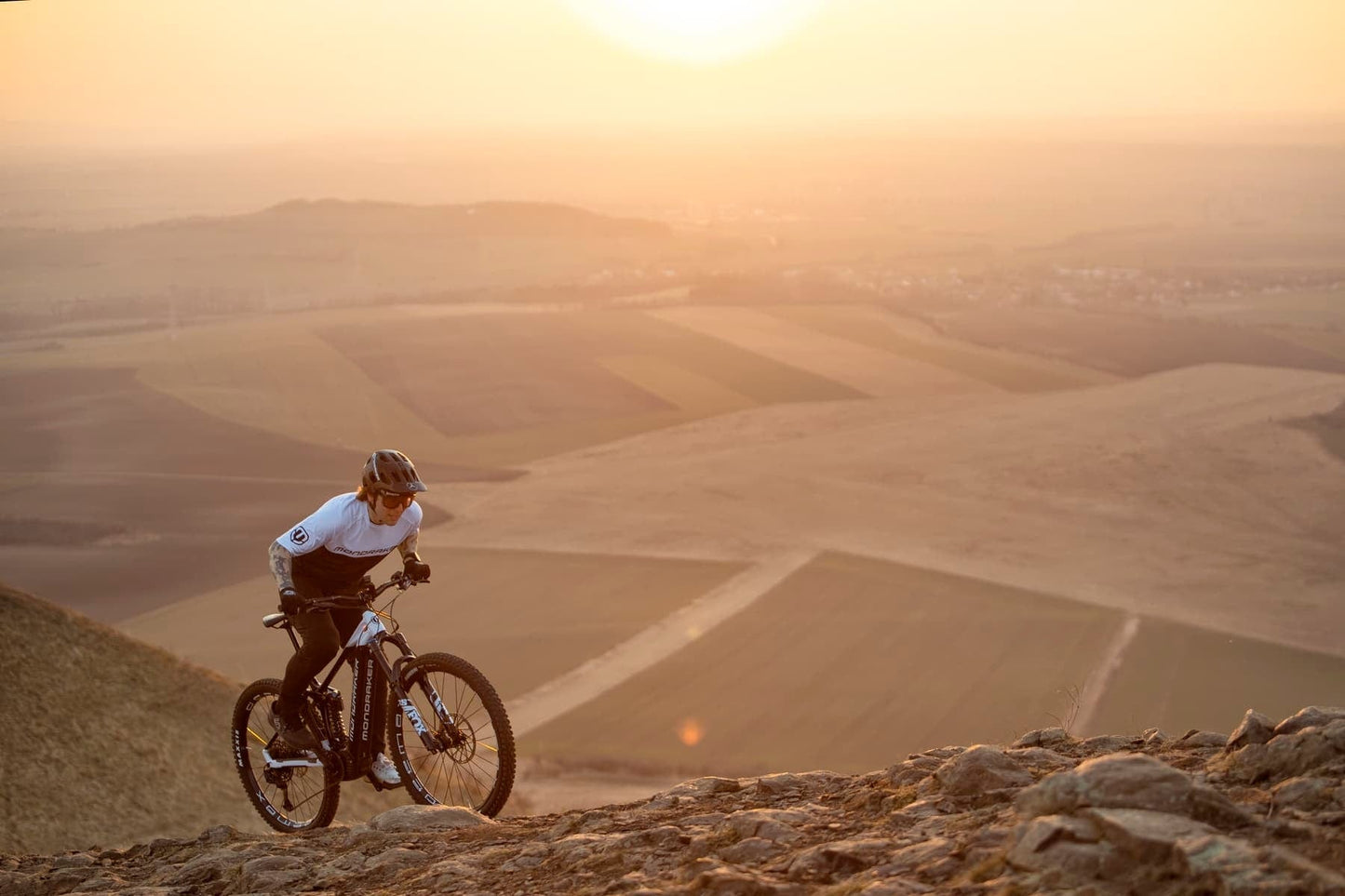 Mondraker Level R eMTB rider going uphill on rocky trail on Fly Rides