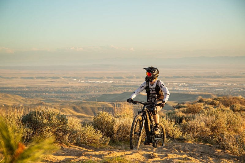 Niner WFO e9 eMTB riding on a trail uphill on Fly Rides
