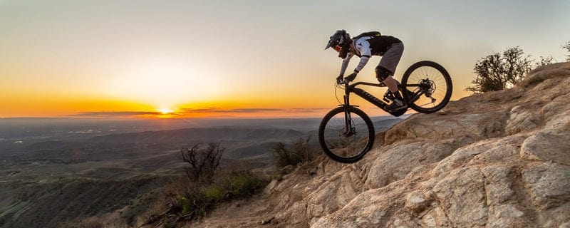 Niner WFO e9 eMTB Riding rocks at sunset on Fly Rides