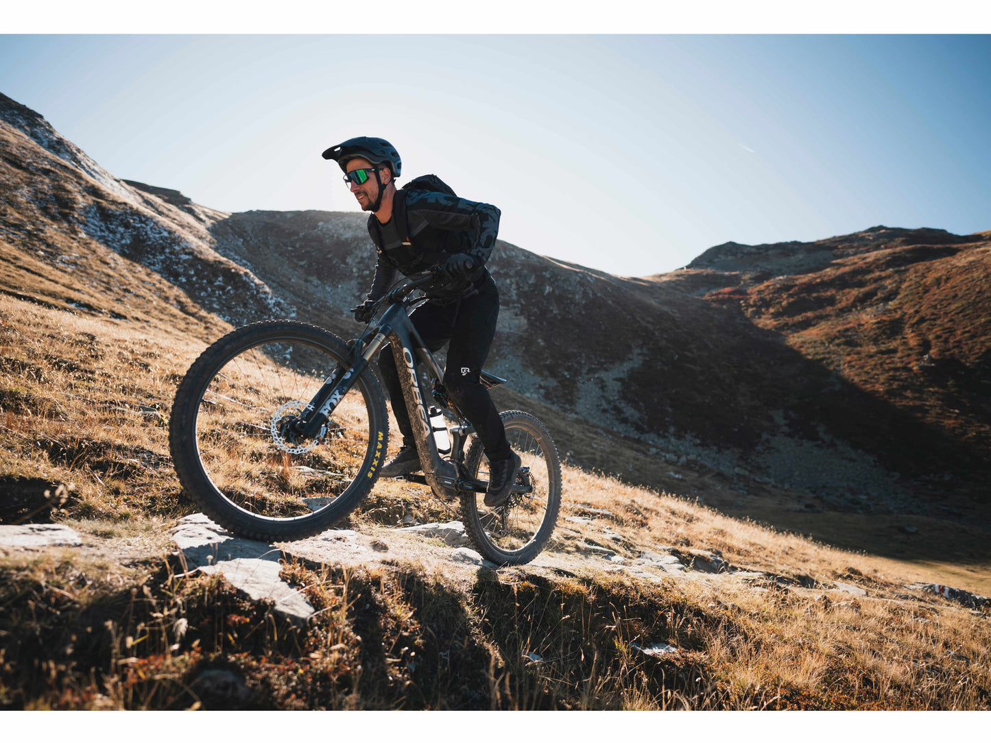 Orbea Rise H20 eMTB full suspension man riding up steep mountain single track