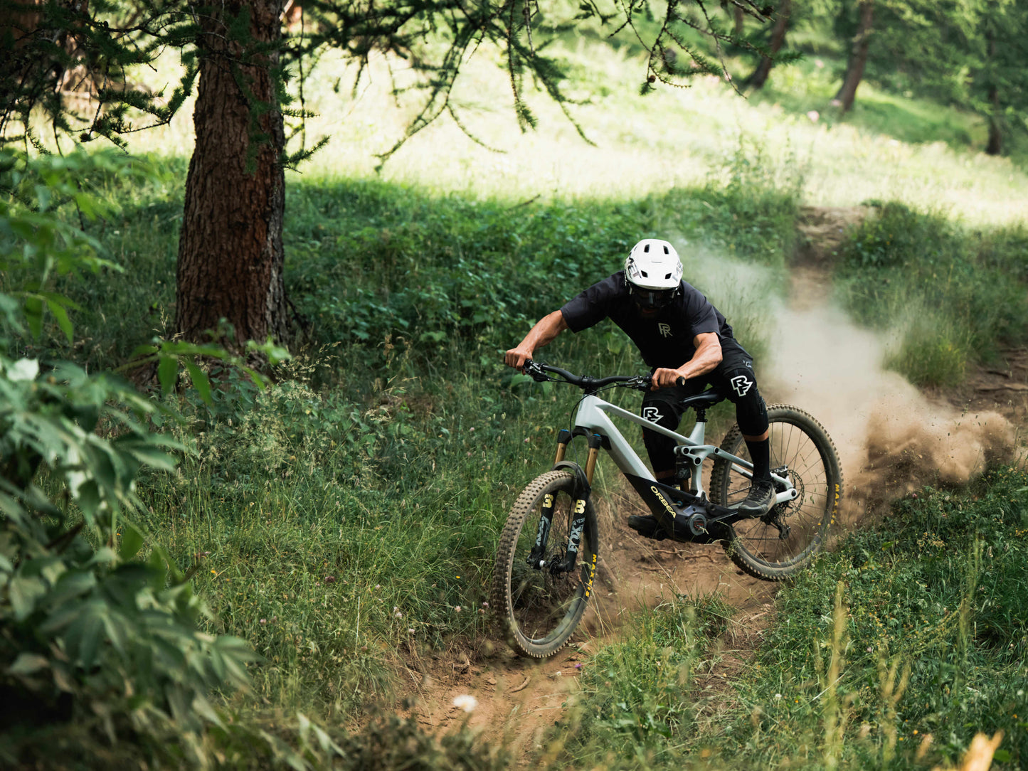 Orbea Wild H30 eMTB full suspension man racing down forest single track trail