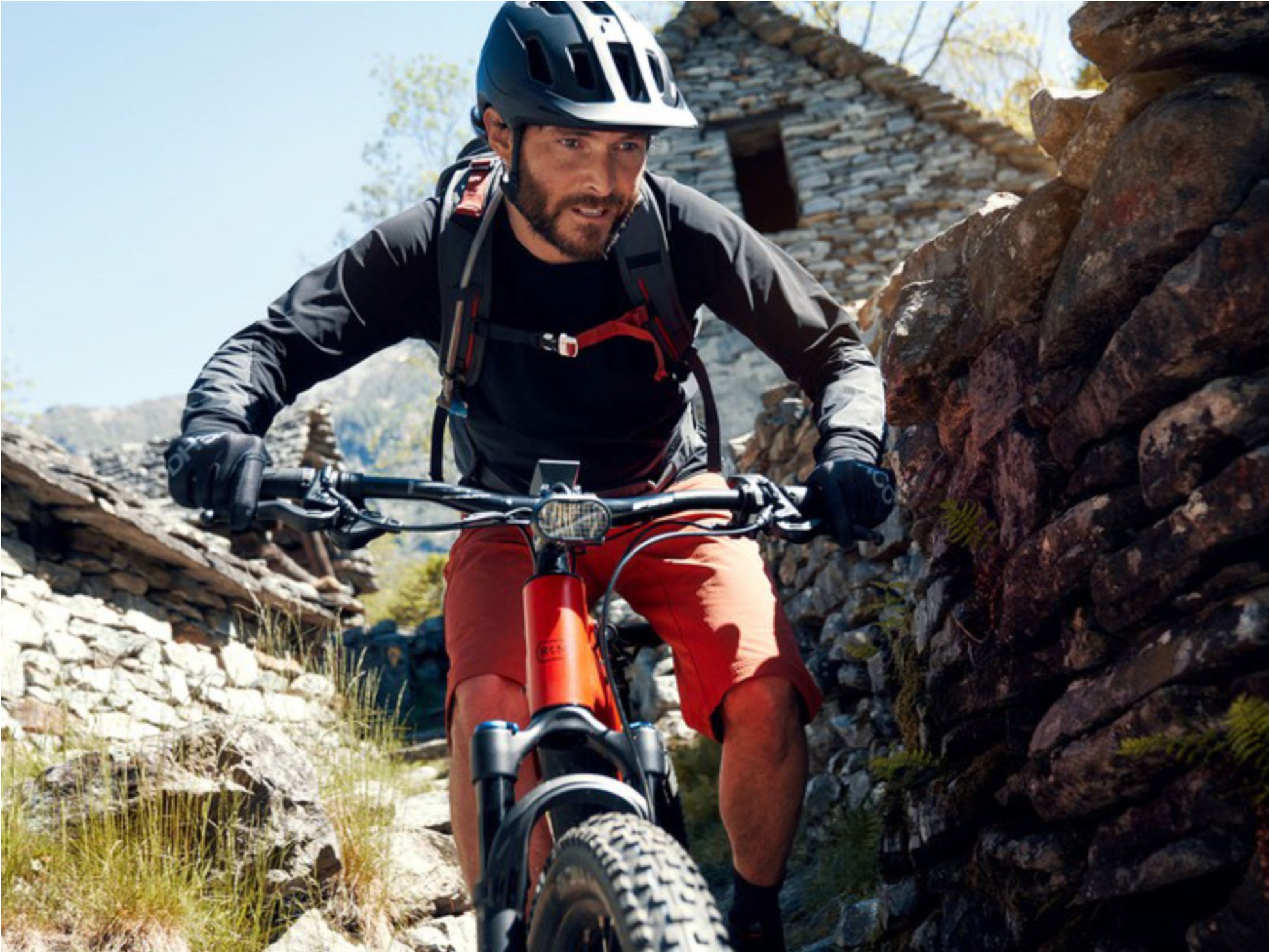 Riese and Muller Delite Mountain Touring eMTB full suspension man riding single track trail