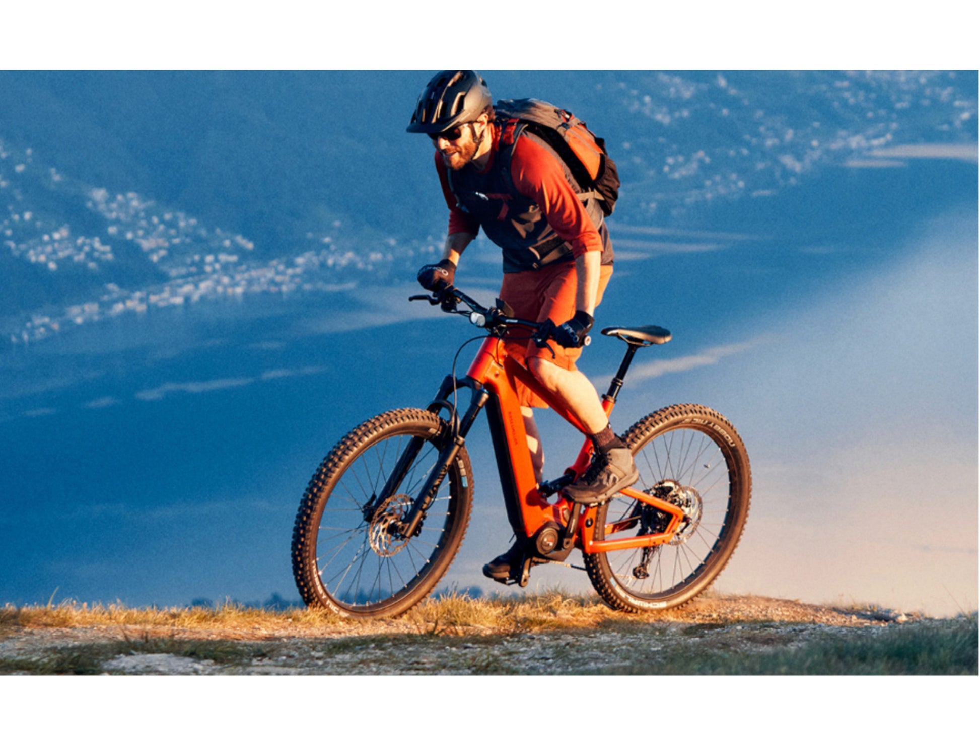 Riese and Muller Delite Mountain Touring eMTB full suspension man riding uphill mountains