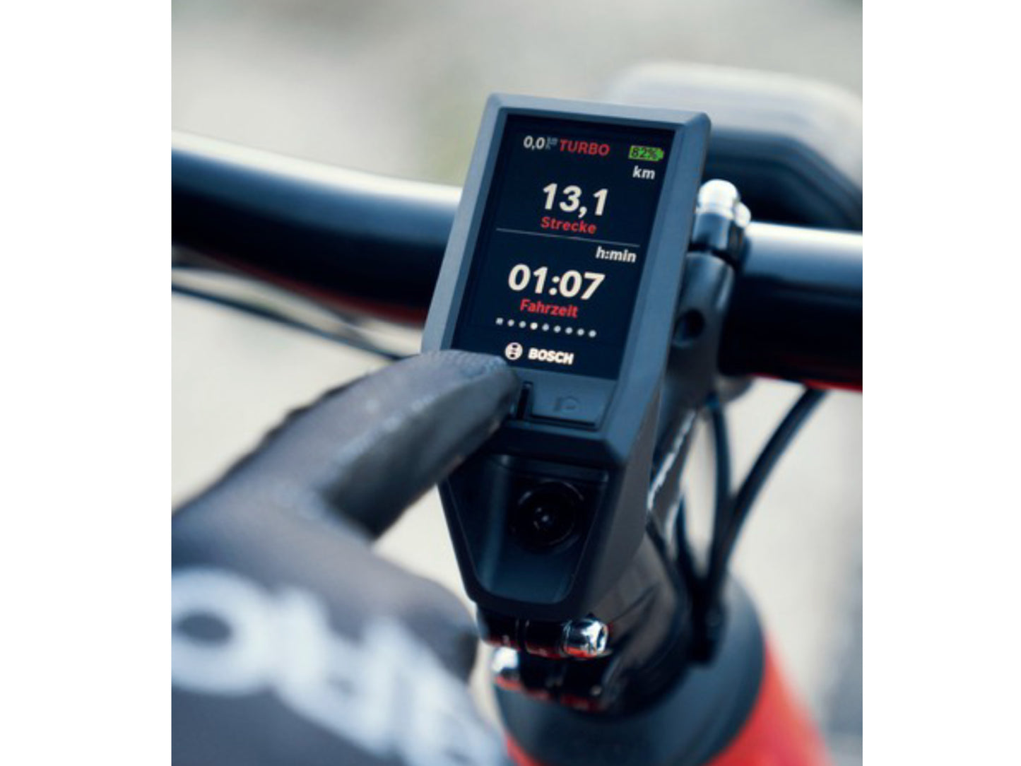 Riese and Muller Delite Mountain Touring eMTB man adjusting display bosch kiox cockpit