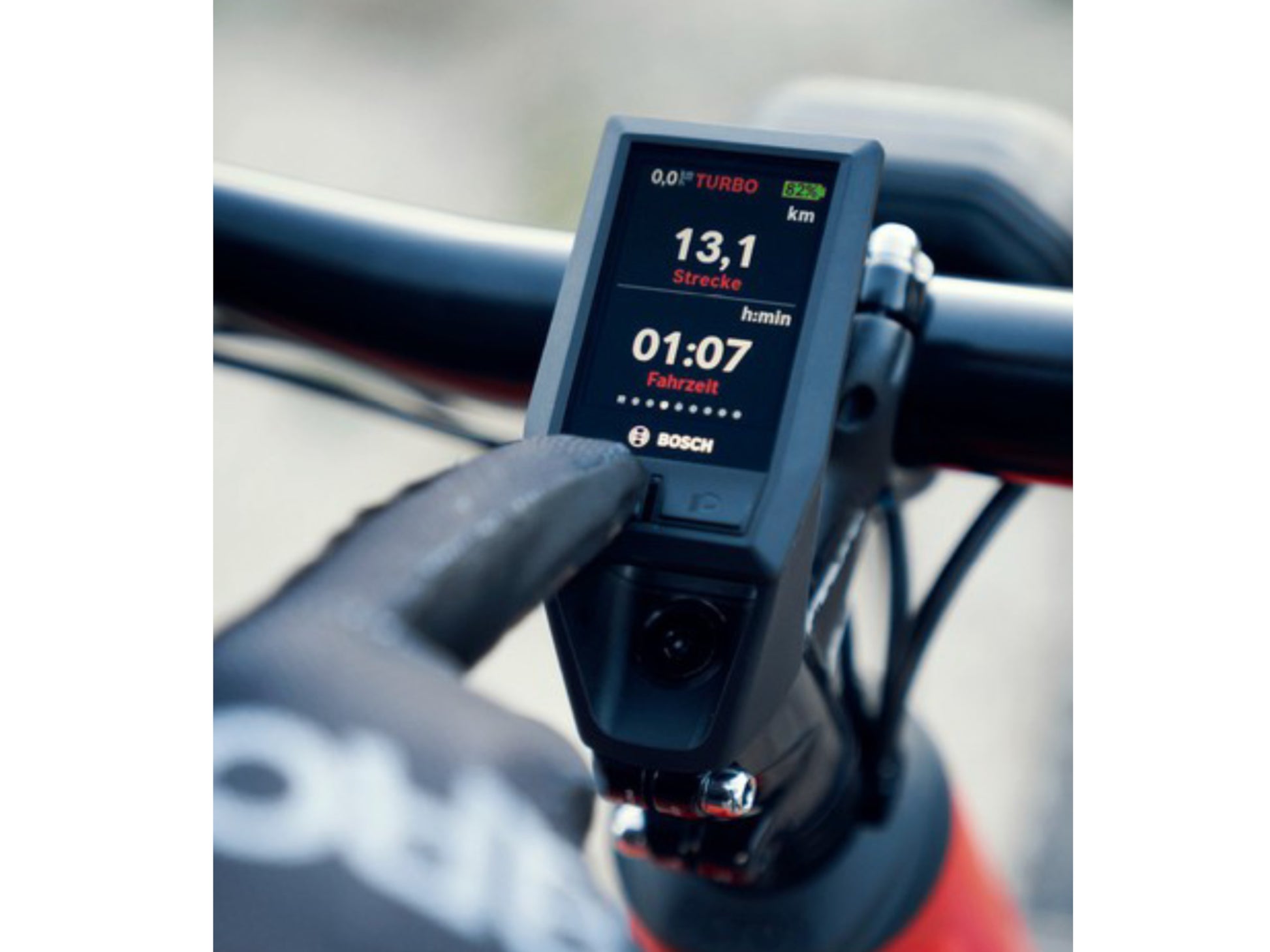 Riese and Muller Delite Mountain Touring eMTB man adjusting display bosch kiox cockpit