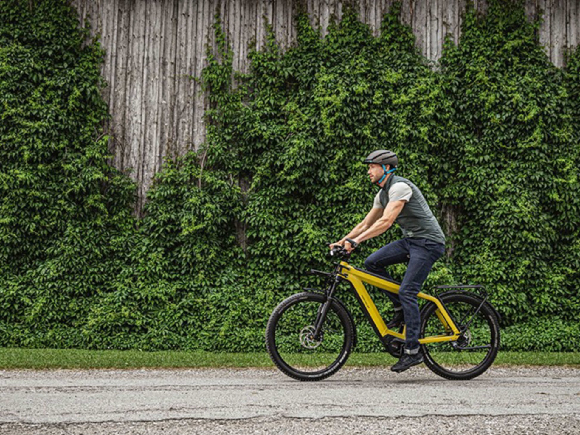 Riese and Muller Supercharger GT Rohloff HS emtb hardtail man riding on country road