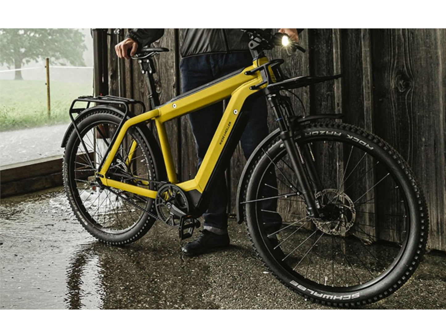 Riese and Muller Supercharger GT Vario emtb hardtail man standing under shelter rain storm