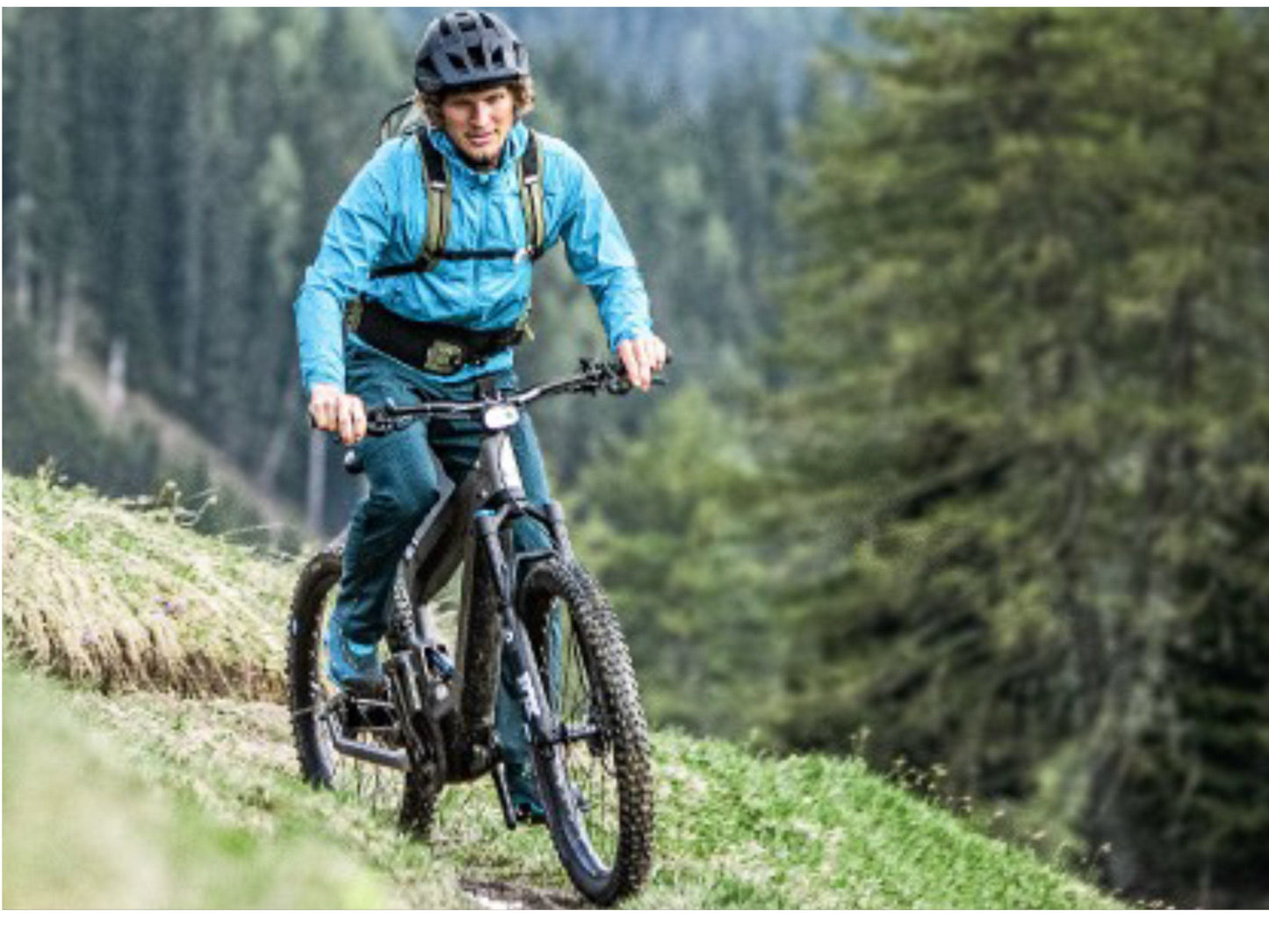 Riese and Muller Superdelite Mountain Touring emtb full suspension action shot climbing mountain trail