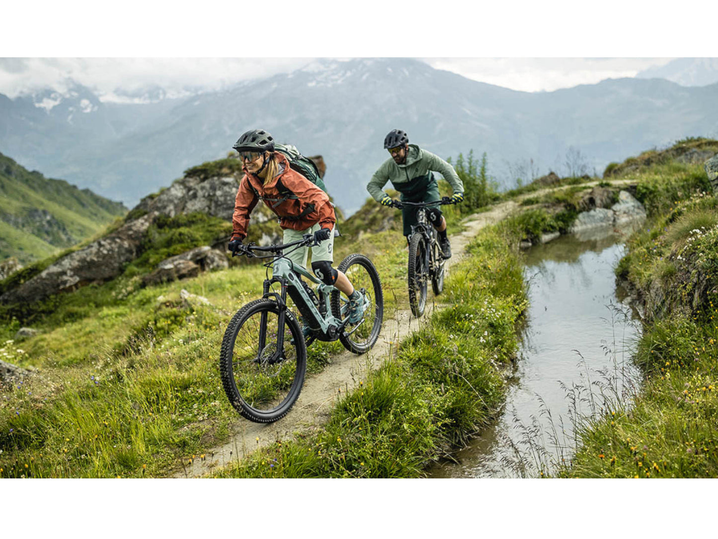 Scott Contessa Active eRide 930 eMTB hard tail man and woman riding on mountain single track