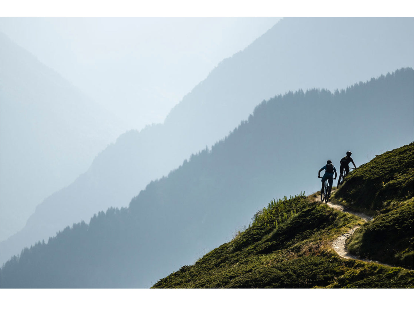 Scott Genius eRide 910 eMTB full suspension two people riding single track in the mountains