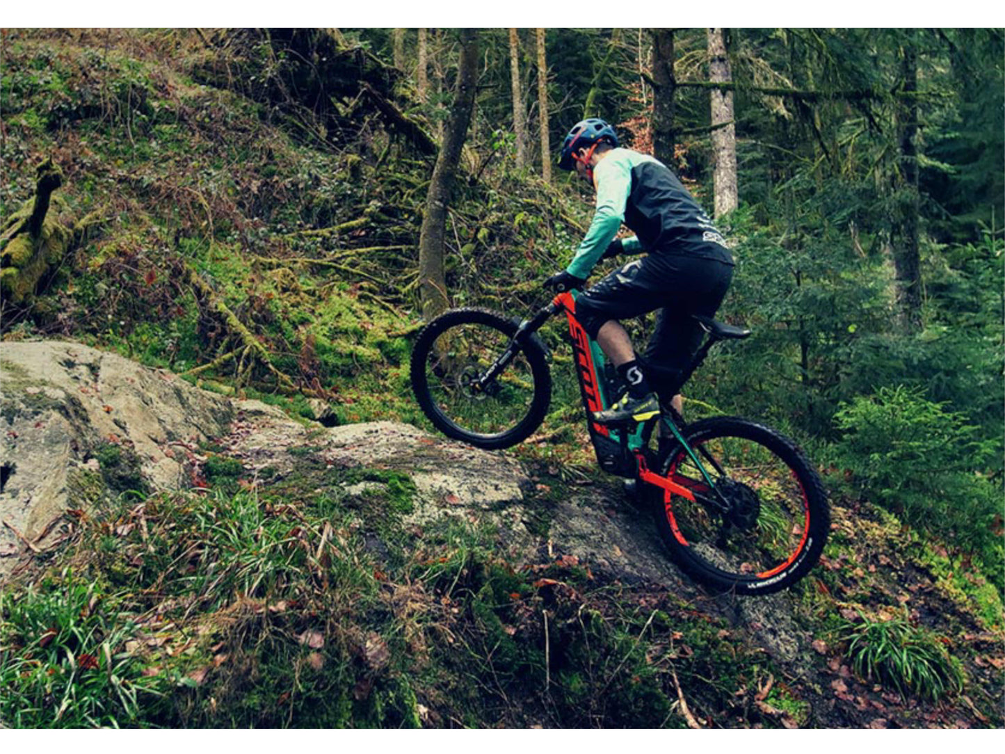 Scott Patron eRide 900 eMTB full suspension person riding technical up hill single track mountain trail