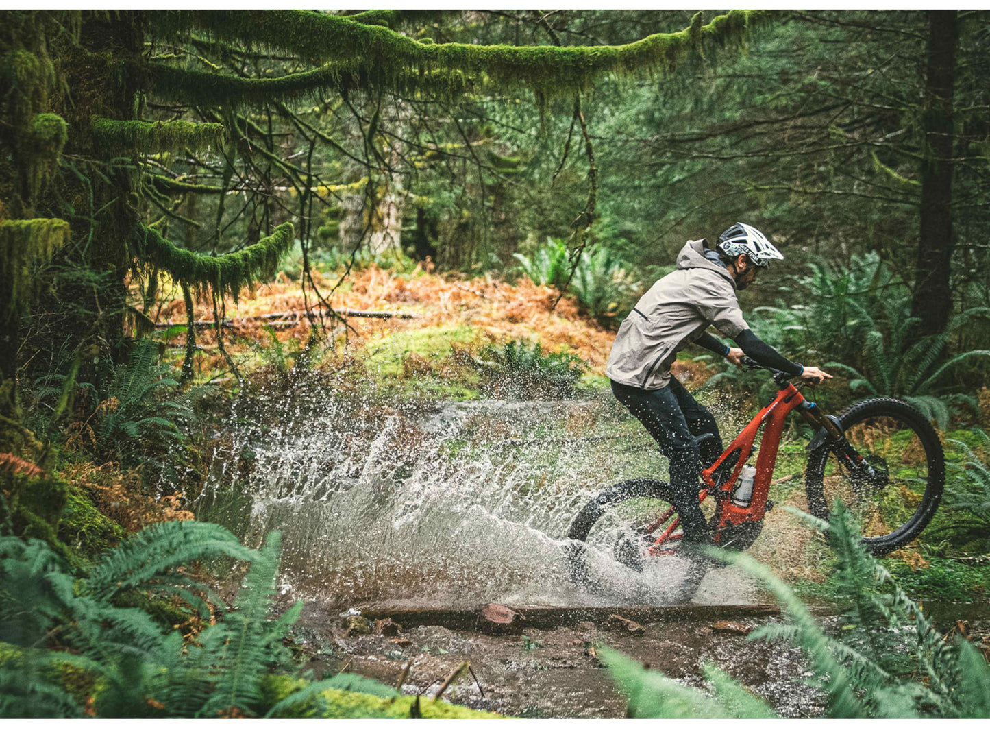 Specialized Turbo Levo Carbon eMtb full suspension man riding through stream in forest