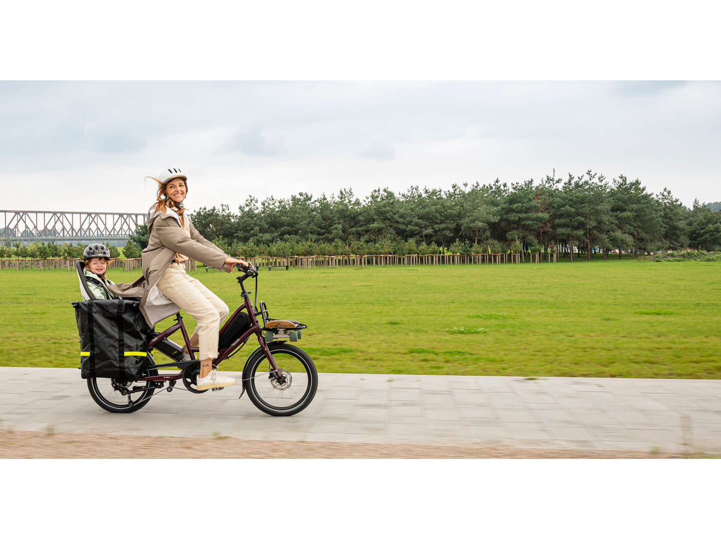 Tern Quick Haul P9 Performance electric cargo bike woman and child riding on bike path