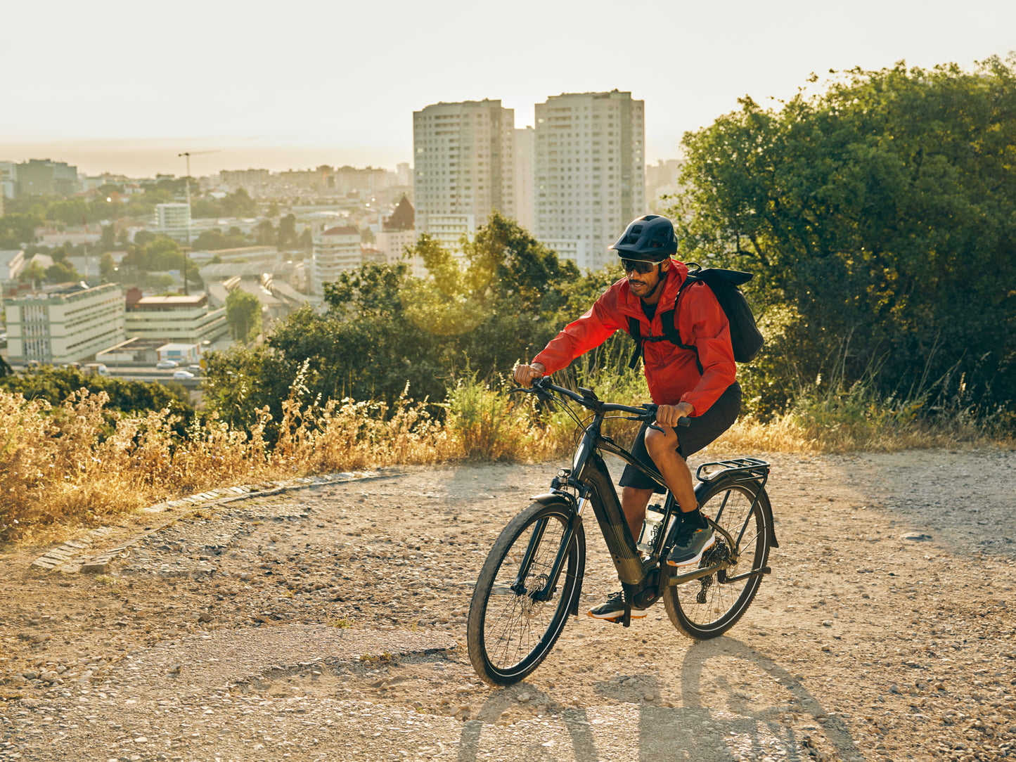 Cannondale Tesoro X Electric bike High Speed Road / Commuter Rider on dirt path overlooking the city