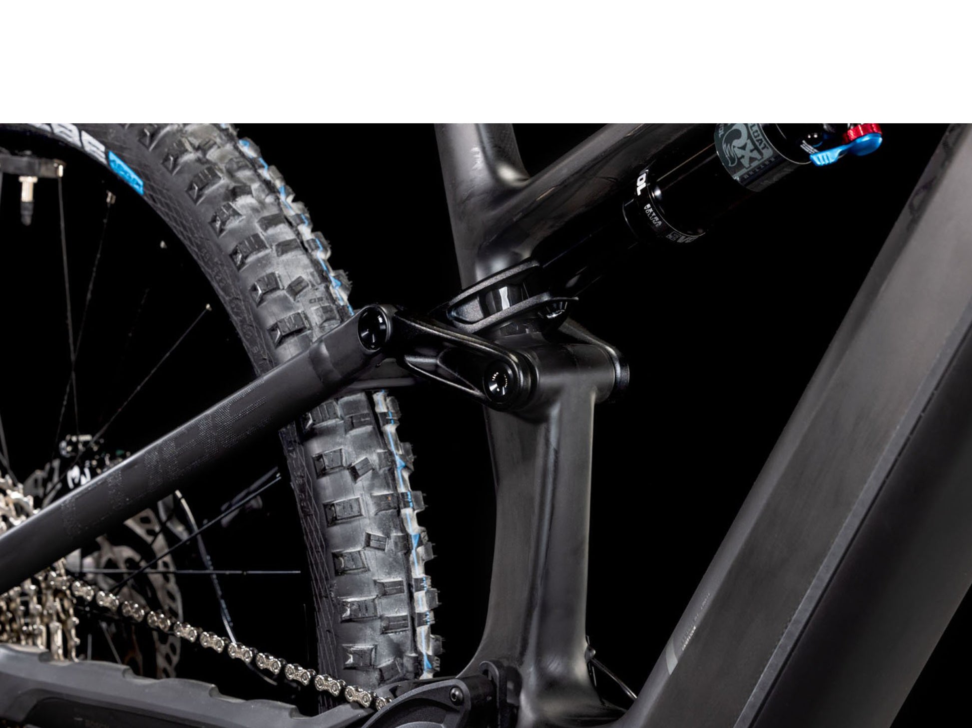 Cube Stereo Hybrid One44 HPC AT 800 Actionteam closeup of rear shock, chain, rear wheel