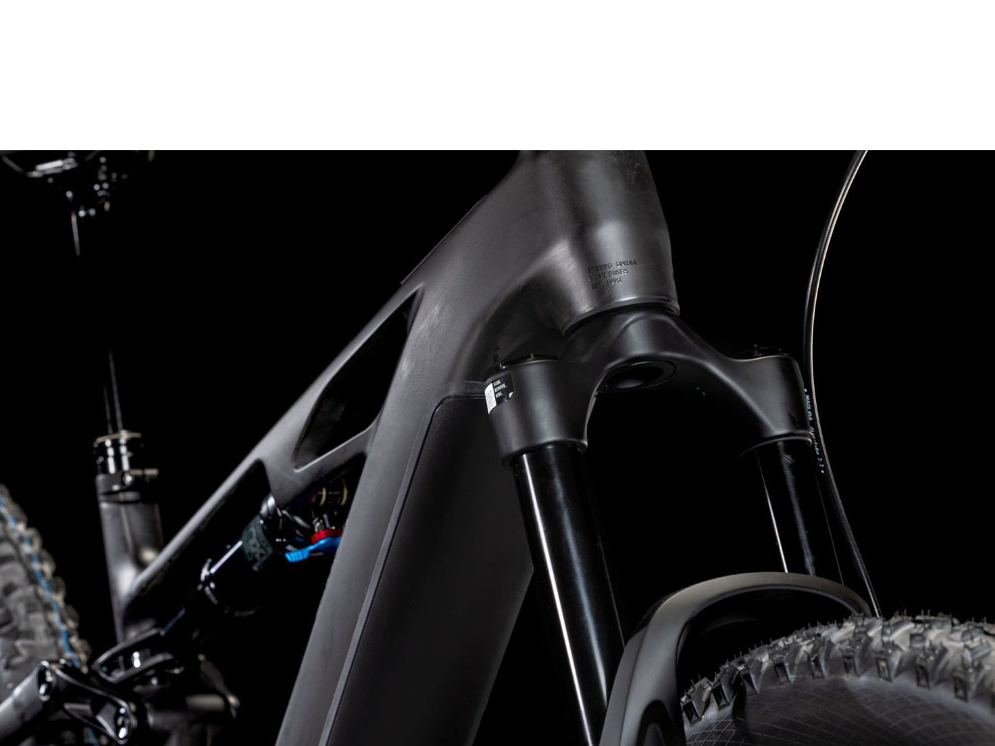 Cube Stereo Hybrid One44 HPC AT 800 Actionteam closeup of rear shock, fork rear facing view