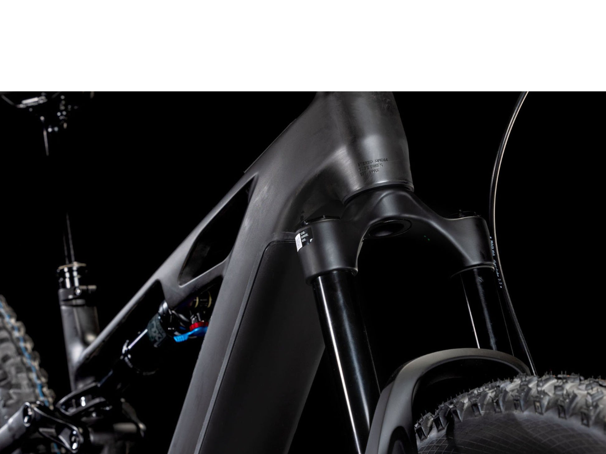 Cube Stereo Hybrid One44 HPC AT 800 Actionteam closeup of rear shock, fork rear facing view