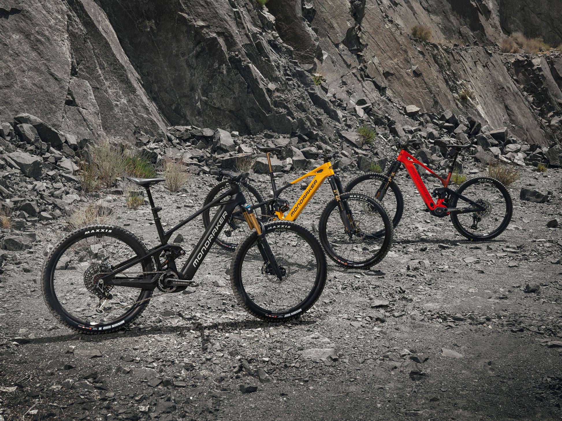 Mondraker Crafty Carbon Full Suspension eMTB Enduro Lineup in a rocky desert background