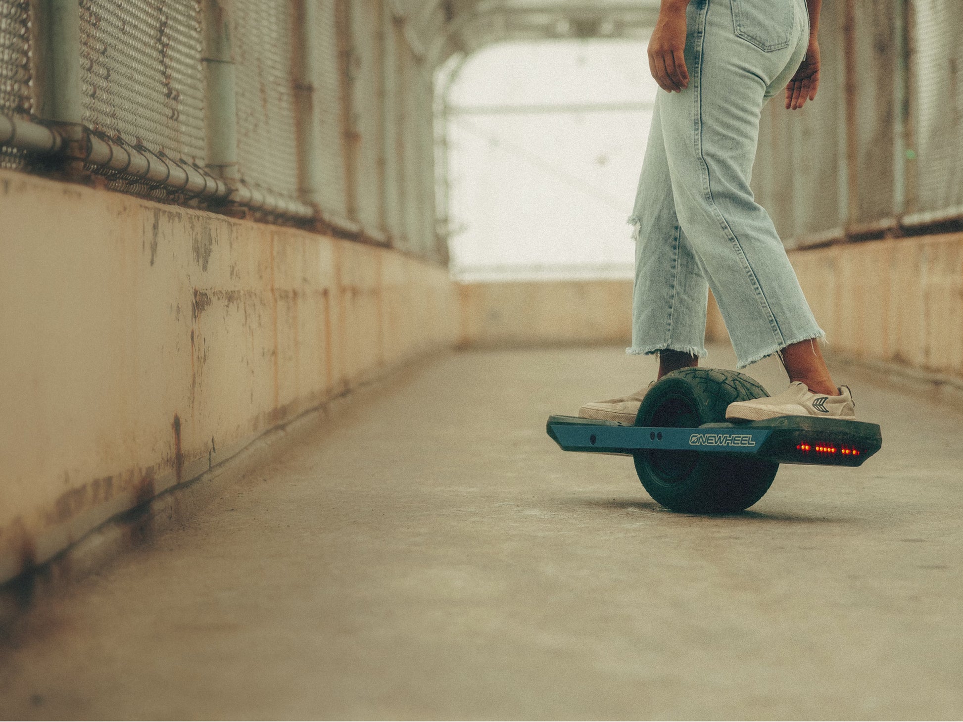 OneWheel XR Classic Board Powder blue Rider cruising