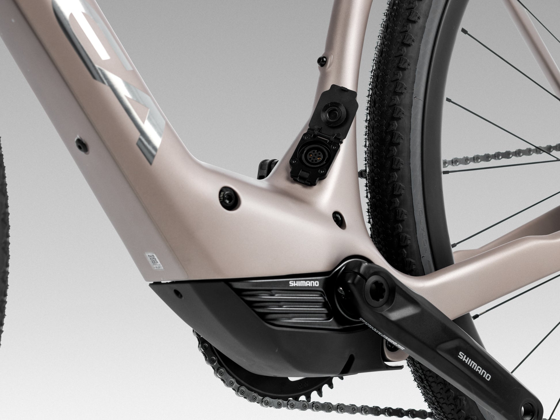 Orbea Denna M20i Gravel Road / commuter Electric bike Nickel matte / carbon raw gloss Motor and charge port closeup