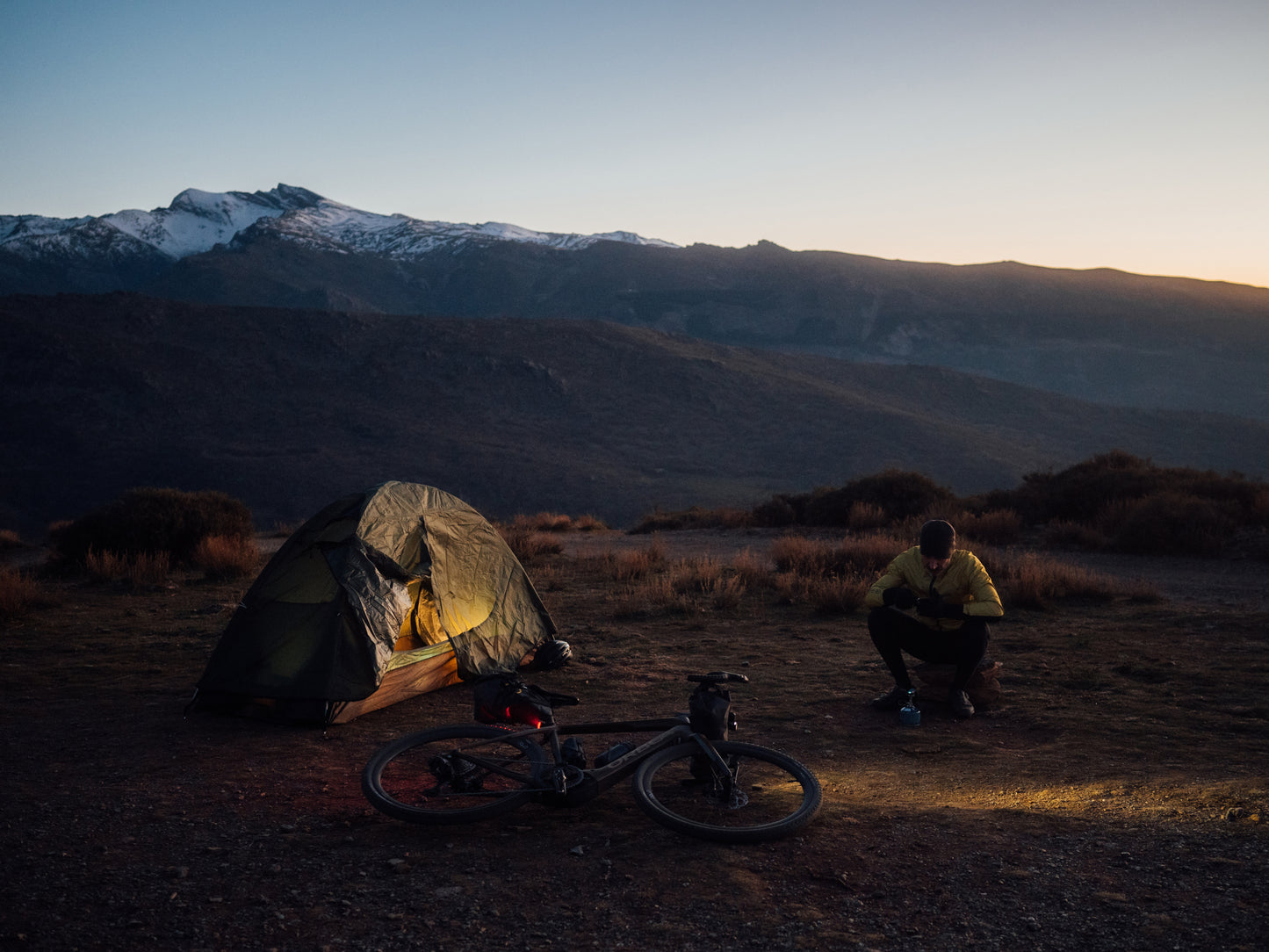 Orbea Denna Gravel Road / commuter Electric bike Rider tent camping in the mountains